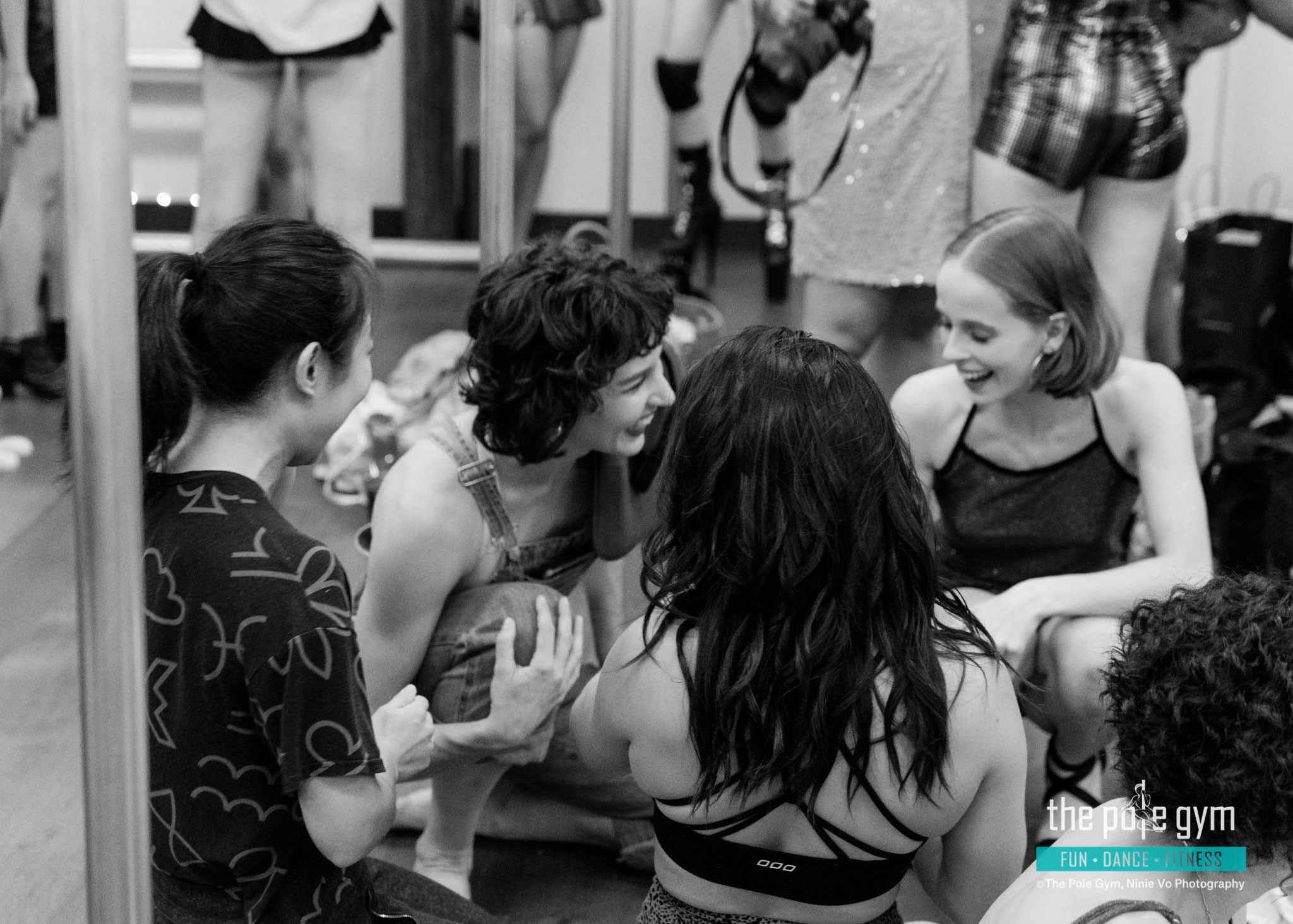The Pole Gym Brisbane City community. Behind the scenes from the 70's Performance Night. Students laughing together.